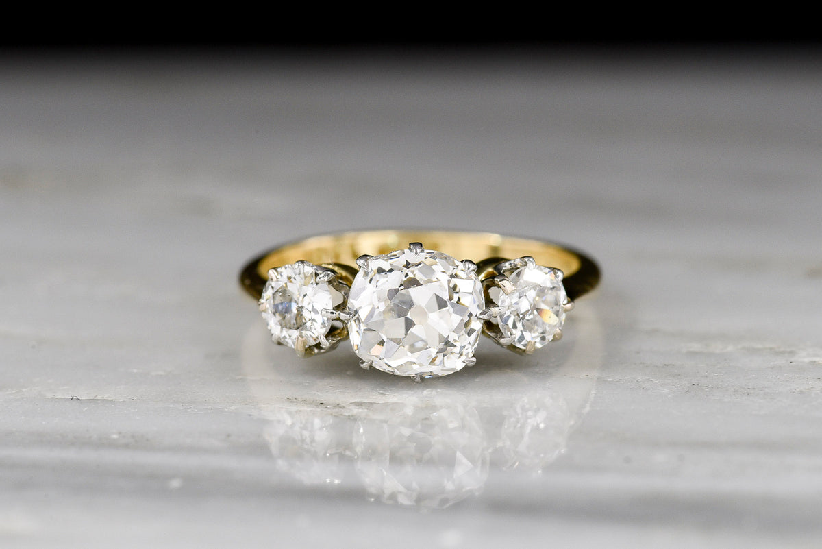 Three-Stone Gold and Platinum Engagement Ring with a GIA 1.13 Carat Old Mine Cut Diamond Center
