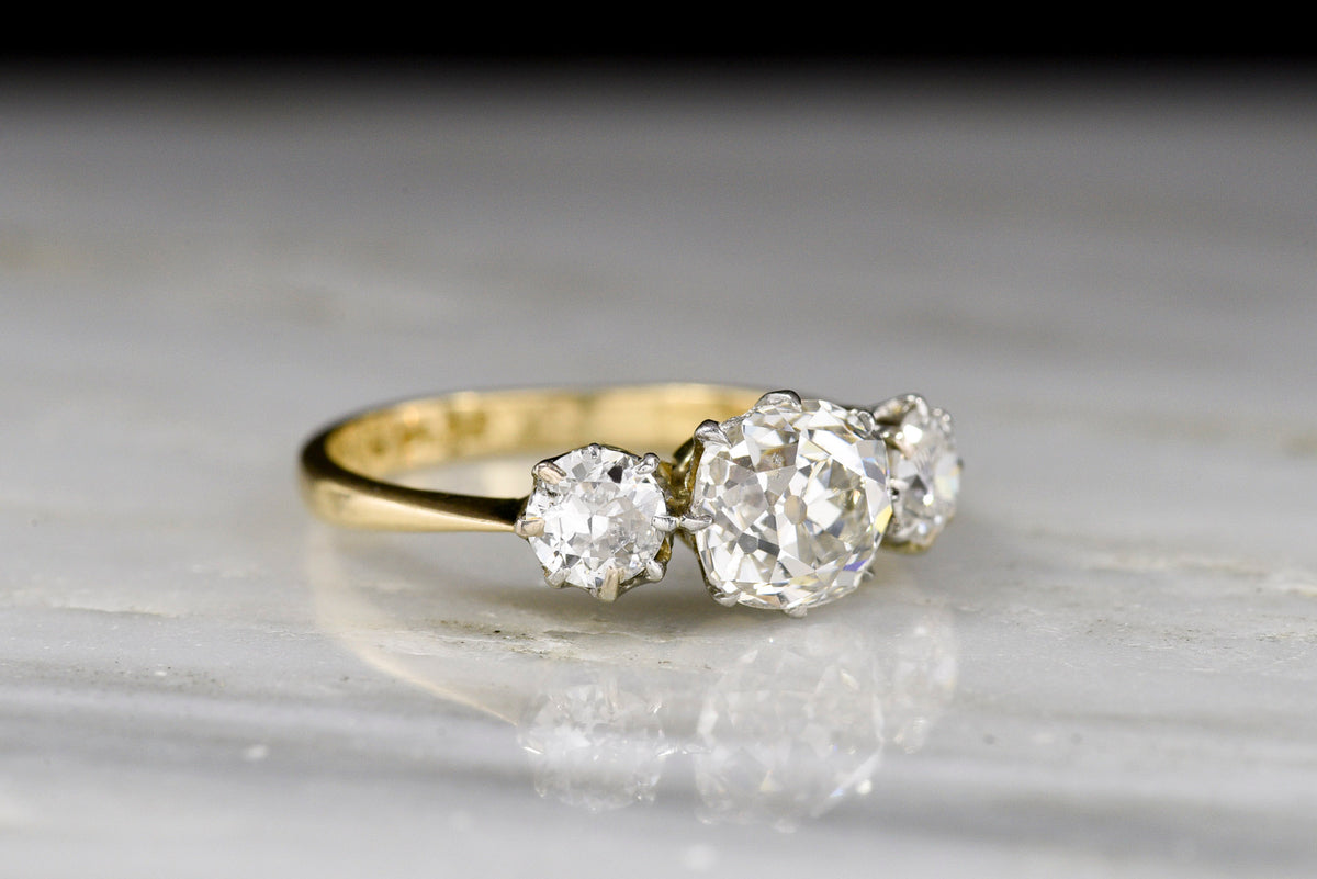 Three-Stone Gold and Platinum Engagement Ring with a GIA 1.13 Carat Old Mine Cut Diamond Center