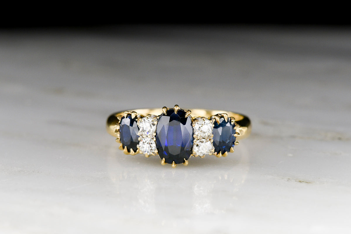 c. Early 1900s Three-Stone Sapphire Ring with Interspersed Diamond Accents