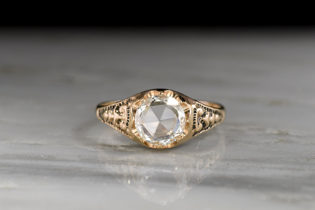 Late 1800s Victorian Belcher Ring with a Round Rose Cut Diamond and Deep-Relief Shoulders