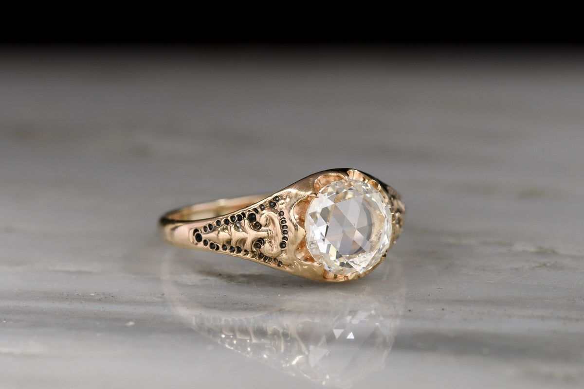 Late 1800s Victorian Belcher Ring with a Round Rose Cut Diamond and Deep-Relief Shoulders