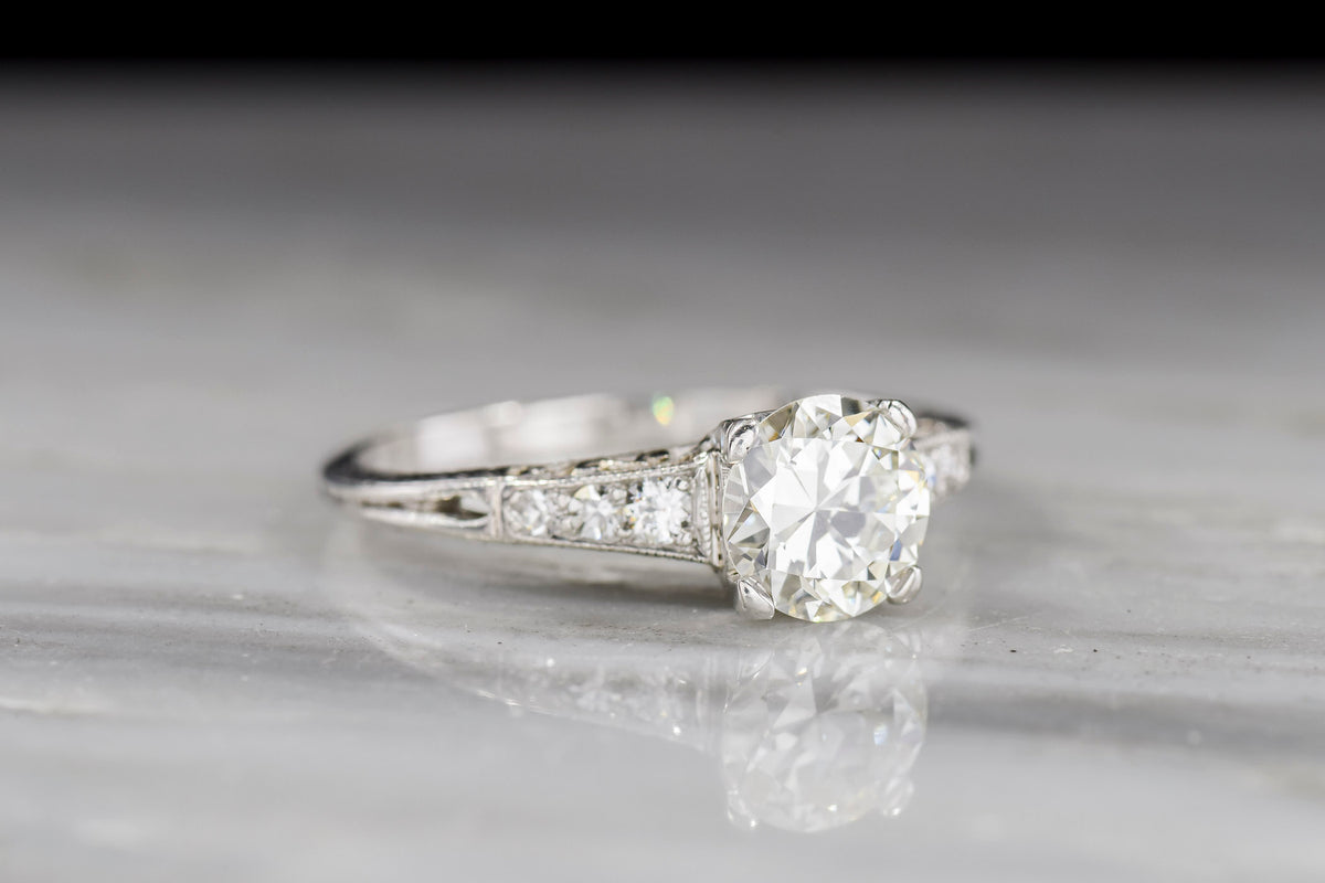 Ornate Late Edwardian / Early Deco Platinum Engagement Ring with a Subtle Inverted Oak Leaf Design