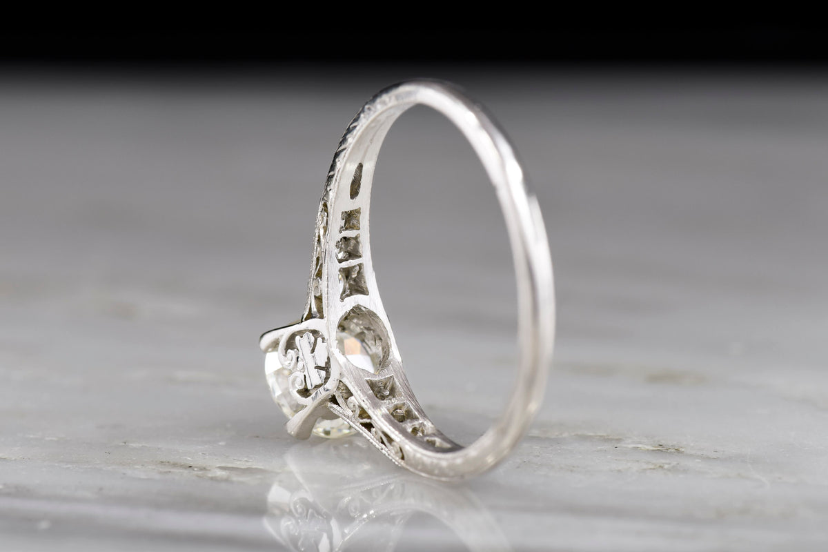 Ornate Late Edwardian / Early Deco Platinum Engagement Ring with a Subtle Inverted Oak Leaf Design