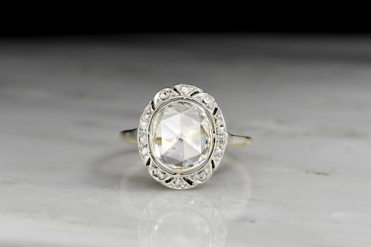 Late Victorian / Belle Époque Ornate Two-Tone Ring with an Oval Rose Cut Diamond Center