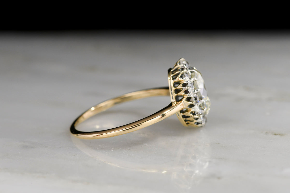 18K Gold and Platinum Cluster Ring with a GIA Oval Cut Diamond Center