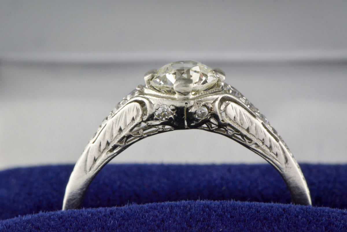 .75 Carat Old European Cut Diamond in a c. 1910s Edwardian / Art Deco Platinum Engagement Ring with Diamond Accents and Floral Engraving / Filigree