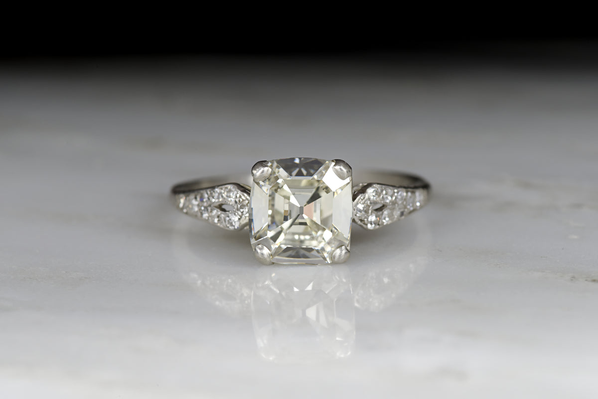 Late Edwardian Engagement Ring with a 1.68 Carat Old Step Cut Diamond Center