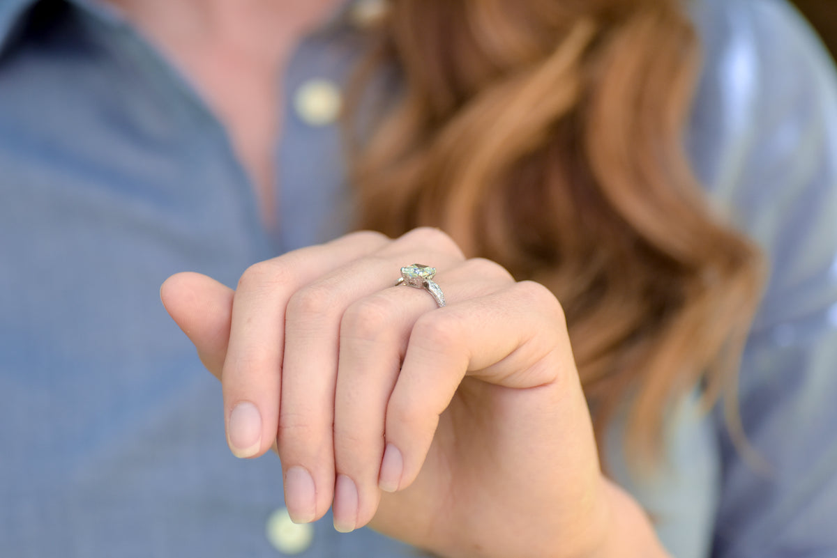 Late Edwardian Engagement Ring with a 1.68 Carat Old Step Cut Diamond Center