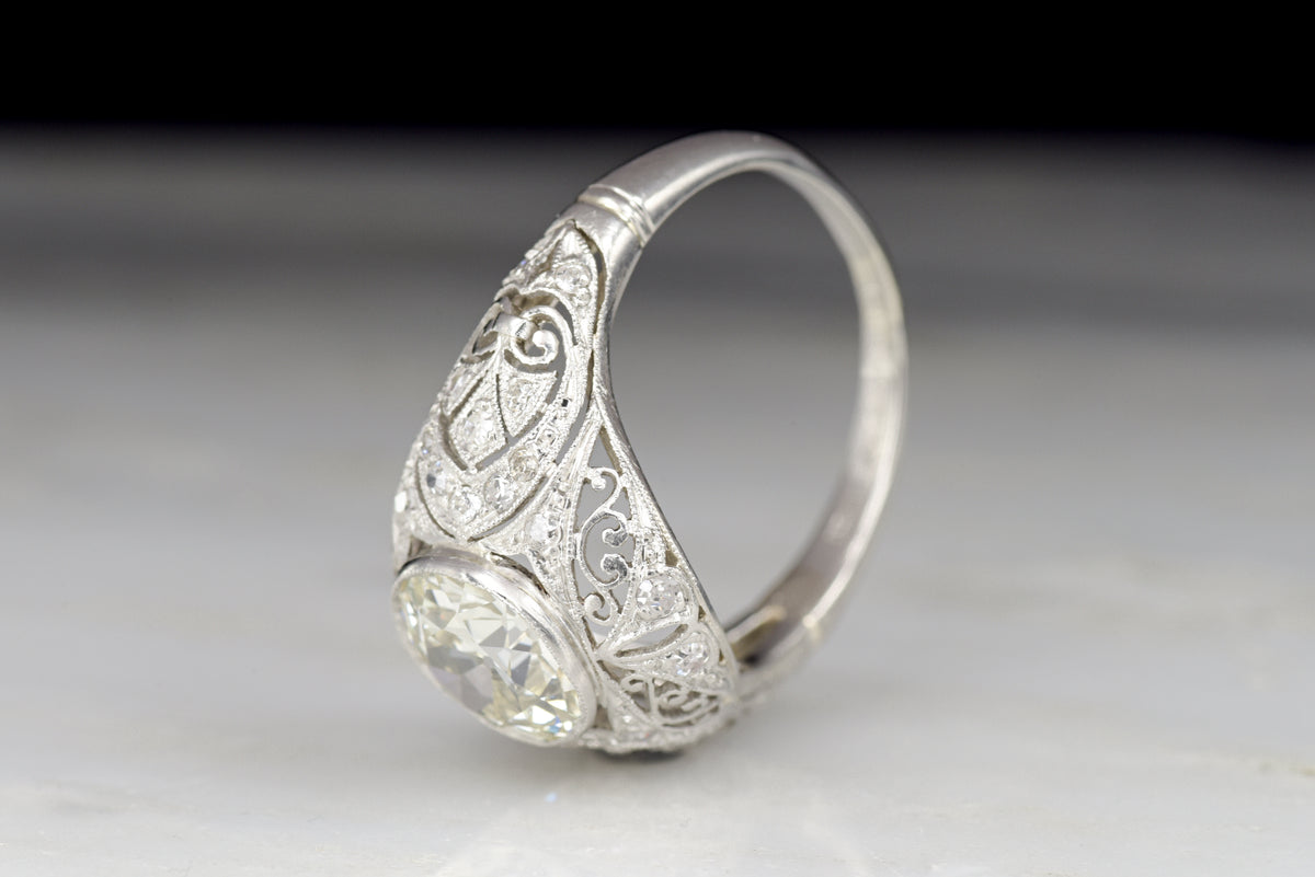 Ornate Hand-Pierced Edwardian Ring with a Late Old European Cut Diamond Center