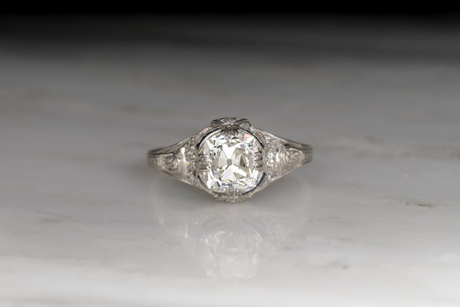 Edwardian / Art Deco Engagement Ring with an Old Mine Cut Diamond and Sapphire Accents
