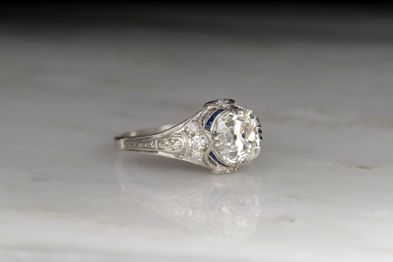 Edwardian / Art Deco Engagement Ring with an Old Mine Cut Diamond and Sapphire Accents
