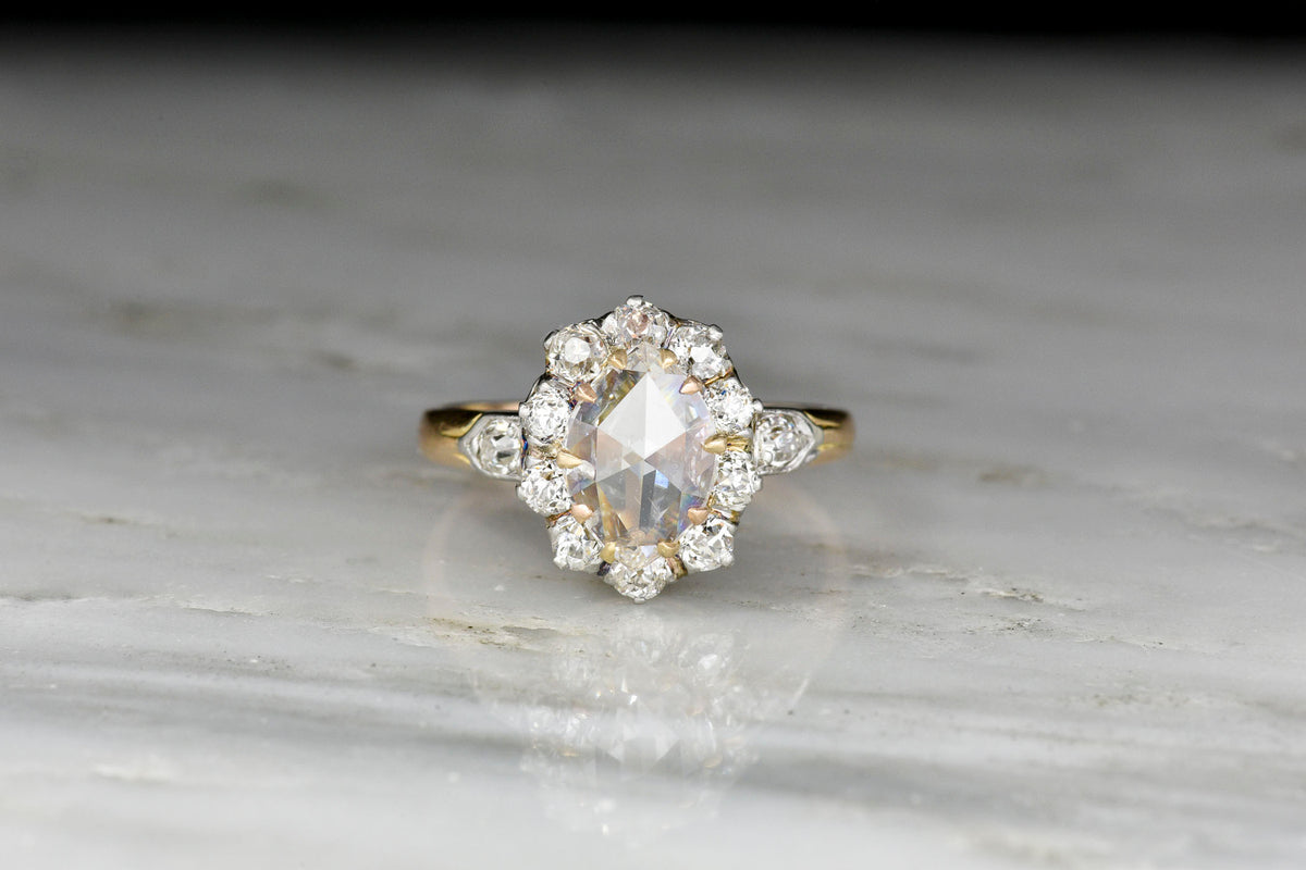 Victorian Gold and Platinum Old Miner Cluster Ring with an Oval Rose Cut Diamond Center