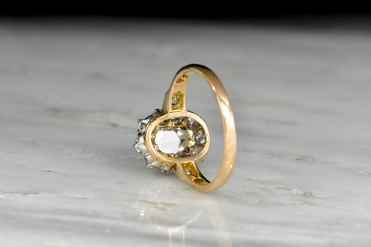 Victorian Gold and Platinum Old Miner Cluster Ring with an Oval Rose Cut Diamond Center