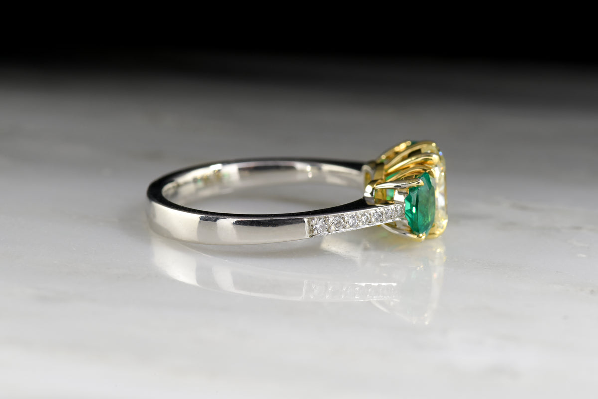 Vintage &quot;Henri Daussi&quot; Engagement Ring with 1.20 Carat Radiant Cushion Cut Light Yellow Diamond and Oval Cut Emeralds