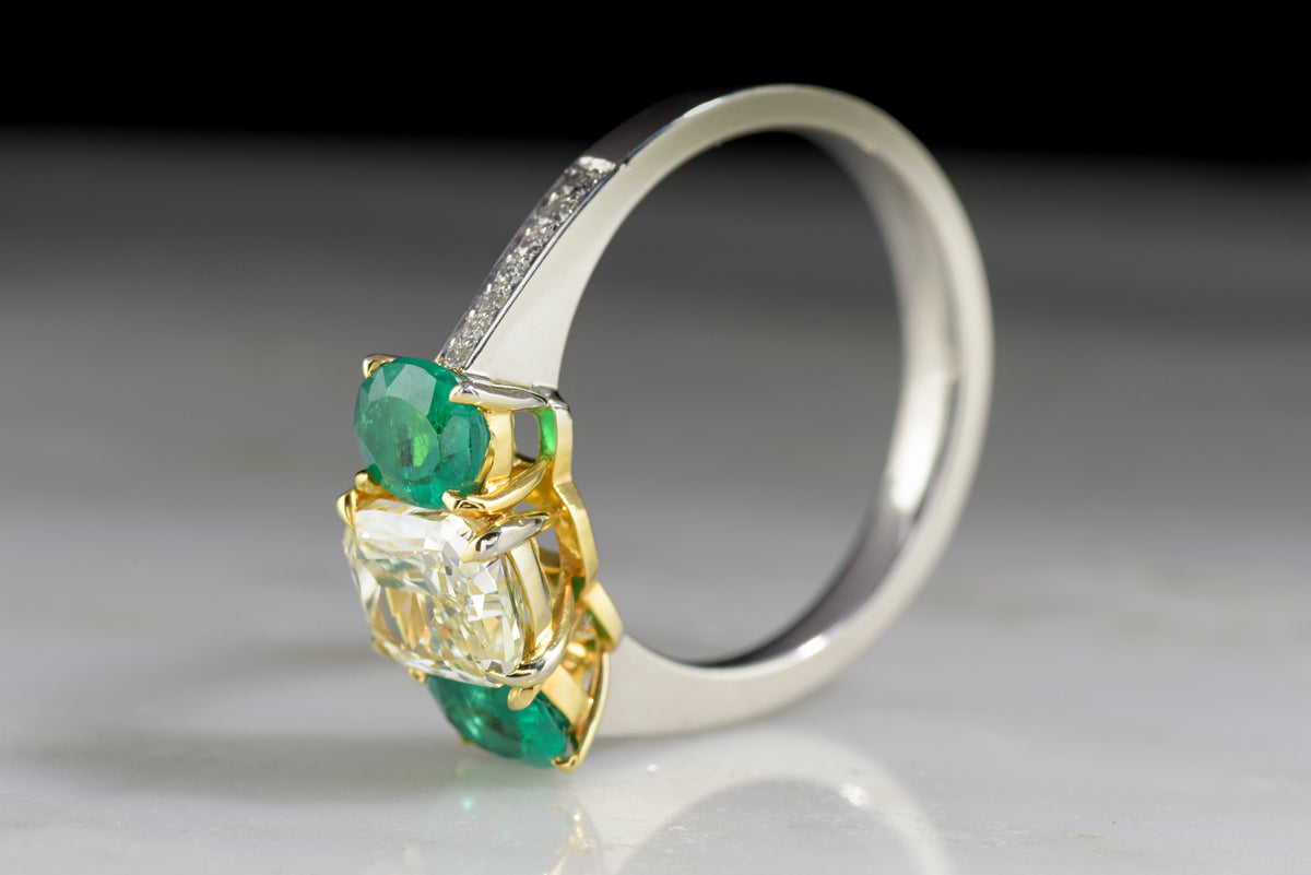 Vintage &quot;Henri Daussi&quot; Engagement Ring with 1.20 Carat Radiant Cushion Cut Light Yellow Diamond and Oval Cut Emeralds