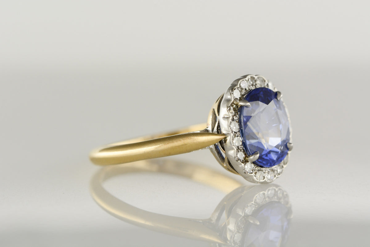 Antique Victorian Diamond Halo, Gold and Platinum Engagement Ring with 3.65 Carat Oval Brilliant Cut Sapphire Center