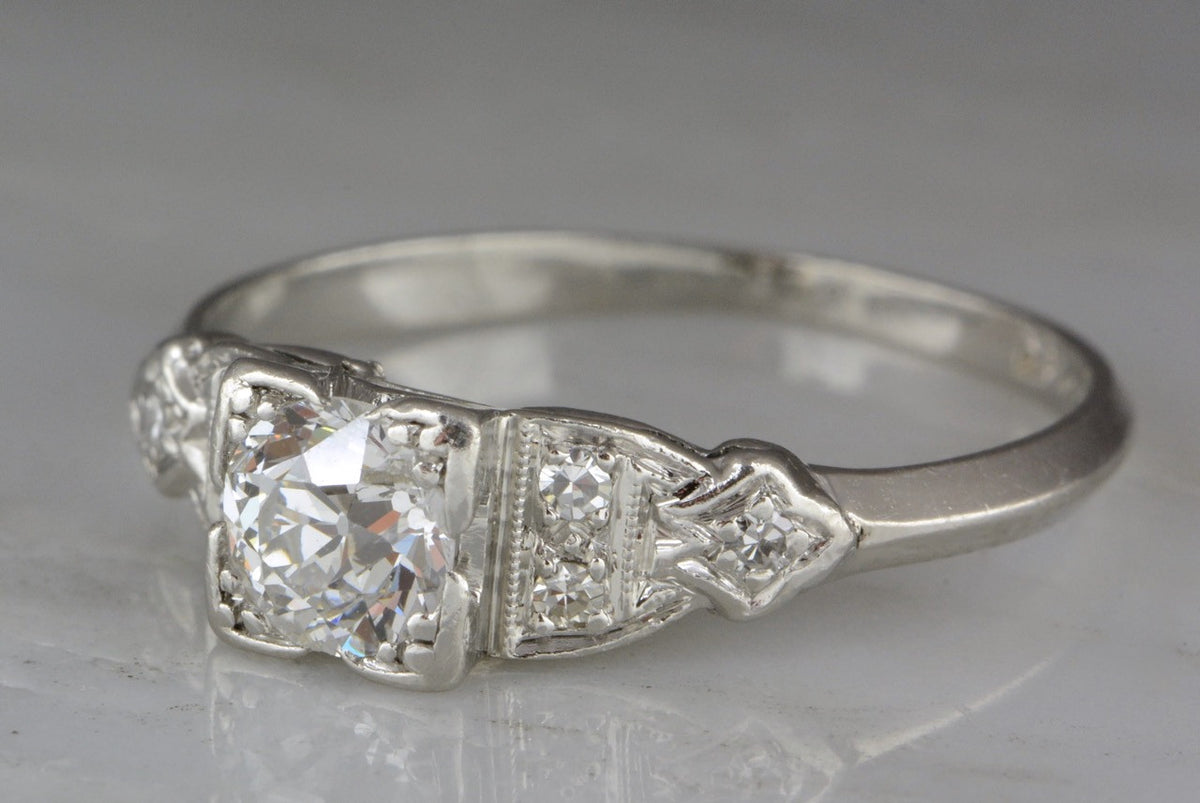 .77ctw Edwardian / Art Deco .65ct Old European Cut Diamond and Platinum Engagement Ring with .12ctw Diamond Accents