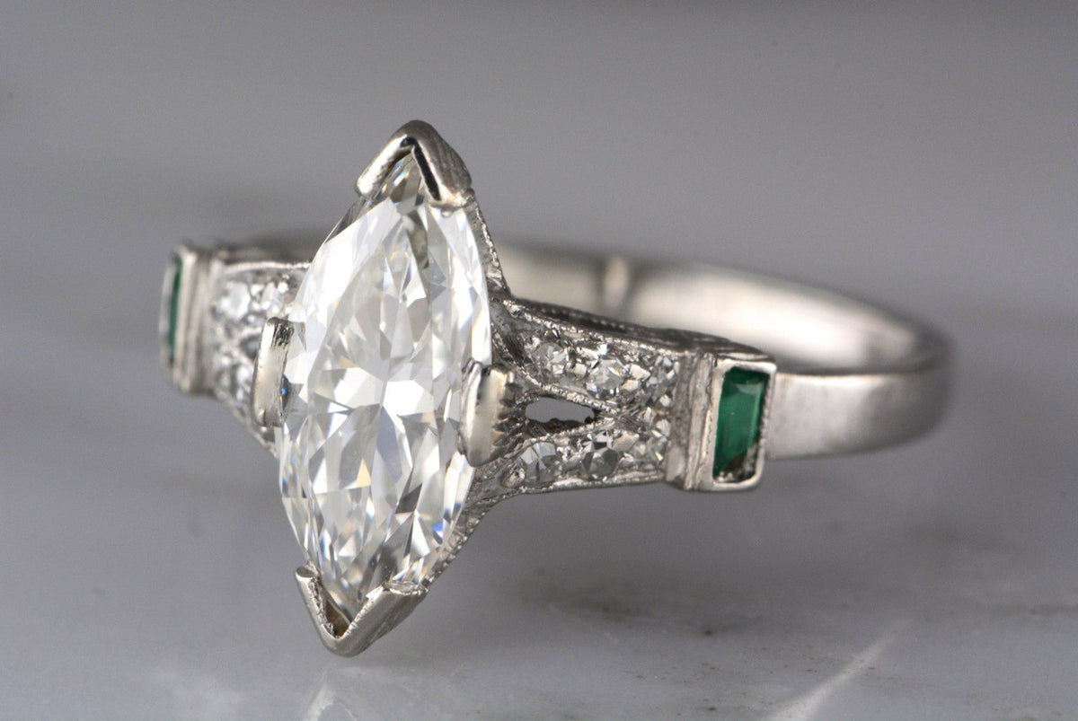 1.60ctw Edwardian / Art Deco Platinum Engagement Ring with 1.35ct Marquise Cut Diamond with Emerald and Single Cut Accents