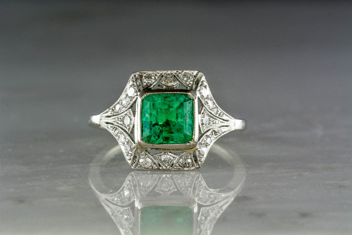 Antique 1.40 Carat Asscher Cut Emerald in an Edwardian / Art Deco Engagement or Anniversary Ring with Single Cut Diamonds