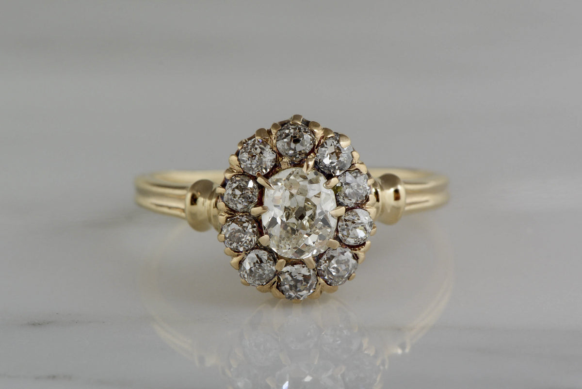1.20ctw Victorian Yellow Gold Engagement Ring with .60ct Oval Cushion Old Mine Cut Diamond and .60ct Old Mine Cut Diamond Accents