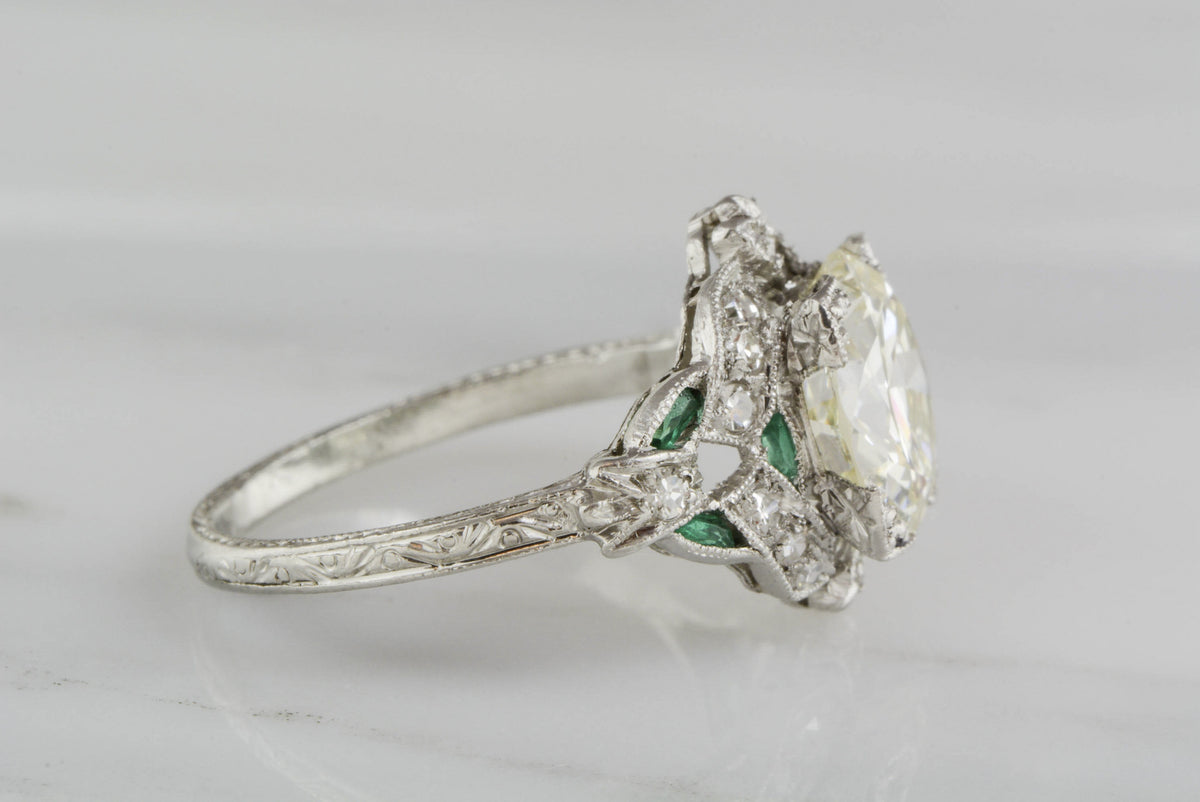 2.85 Carat Old European Cut Diamond (3.60 ctw) and Platinum Edwardian Engagement Ring; .50 ctw Single Cut Diamonds and .25 ctw Emeralds