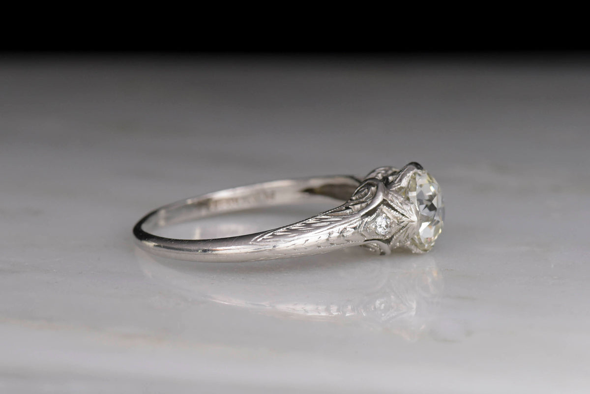 Late Edwardian Diamond and Platinum Engagement Ring with Scroll Filigree