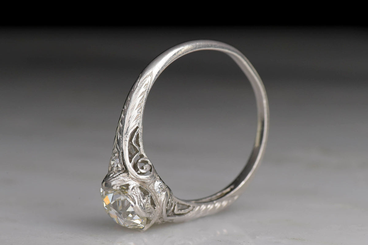 Late Edwardian Diamond and Platinum Engagement Ring with Scroll Filigree