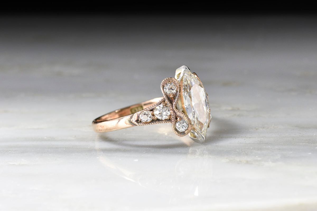 Victorian Rose Gold and Platinum Ring with a GIA Marquise Cut Diamond Center