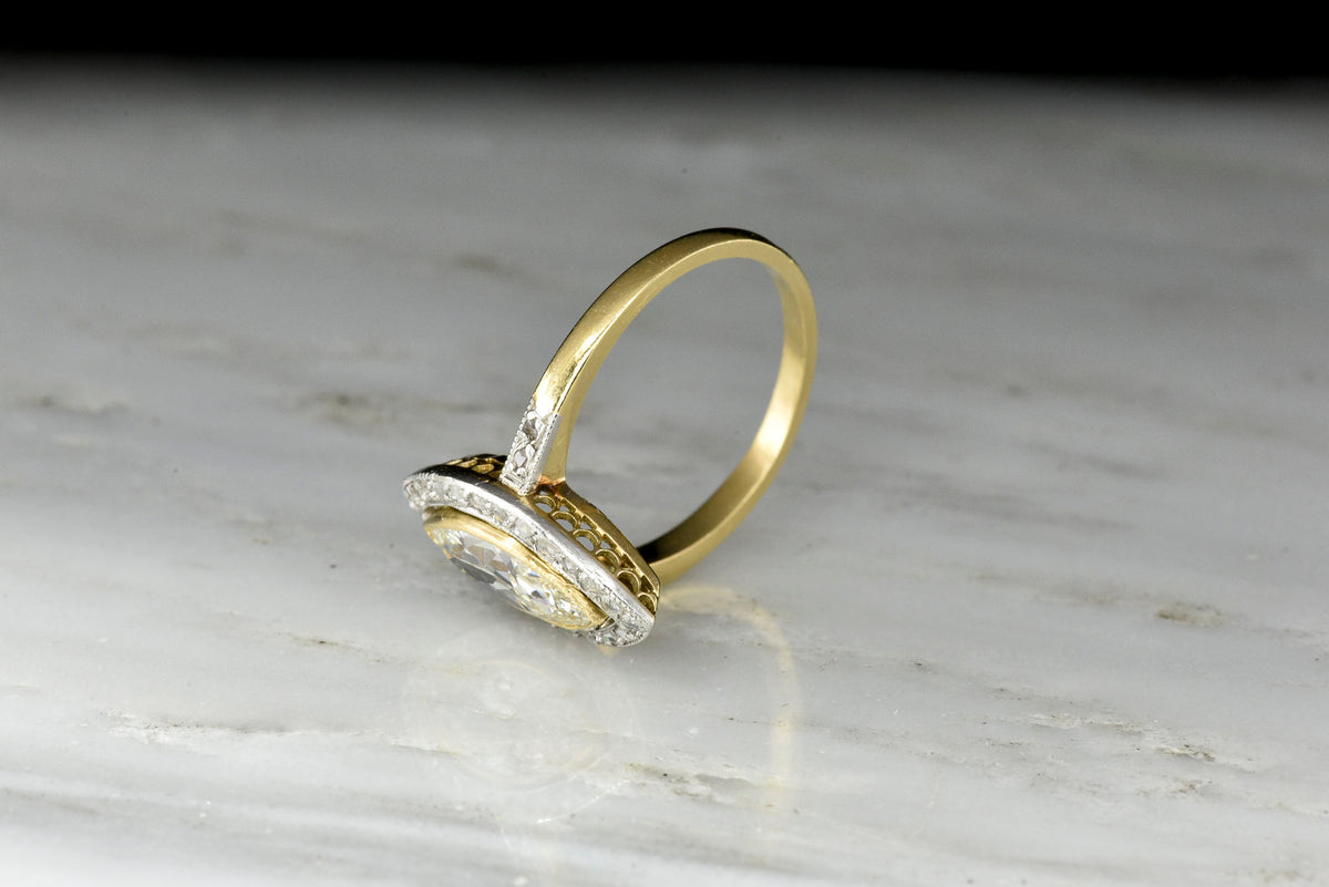 Belle Époque Gold and Platinum Ring with a Marquise Cut Diamond Center