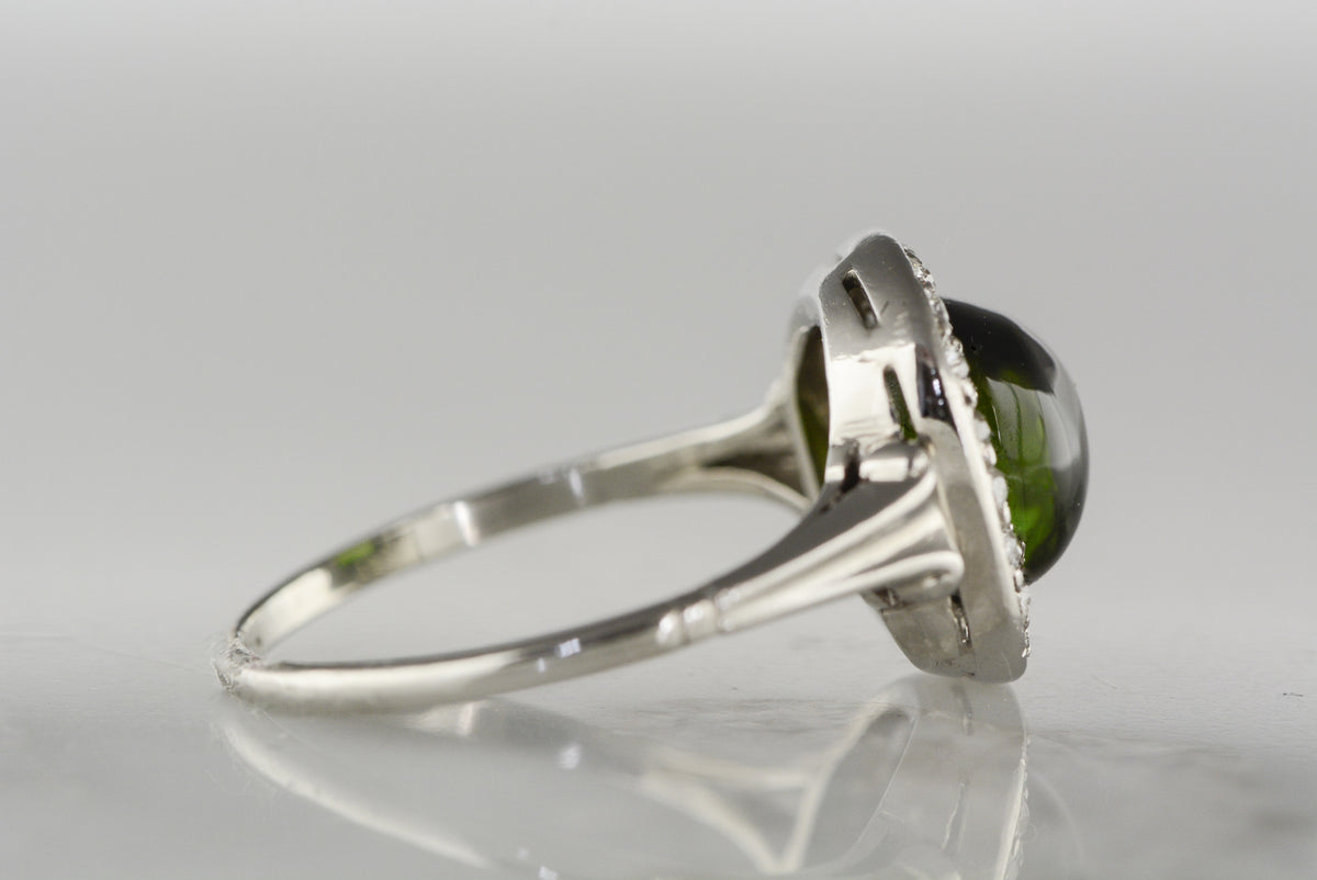 Art Deco Platinum Engagement Ring with 2.30 Carat Cabochon Cut Tourmaline and Old Mine Cut Diamond Halo