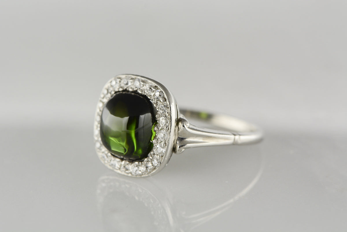 Art Deco Platinum Engagement Ring with 2.30 Carat Cabochon Cut Tourmaline and Old Mine Cut Diamond Halo