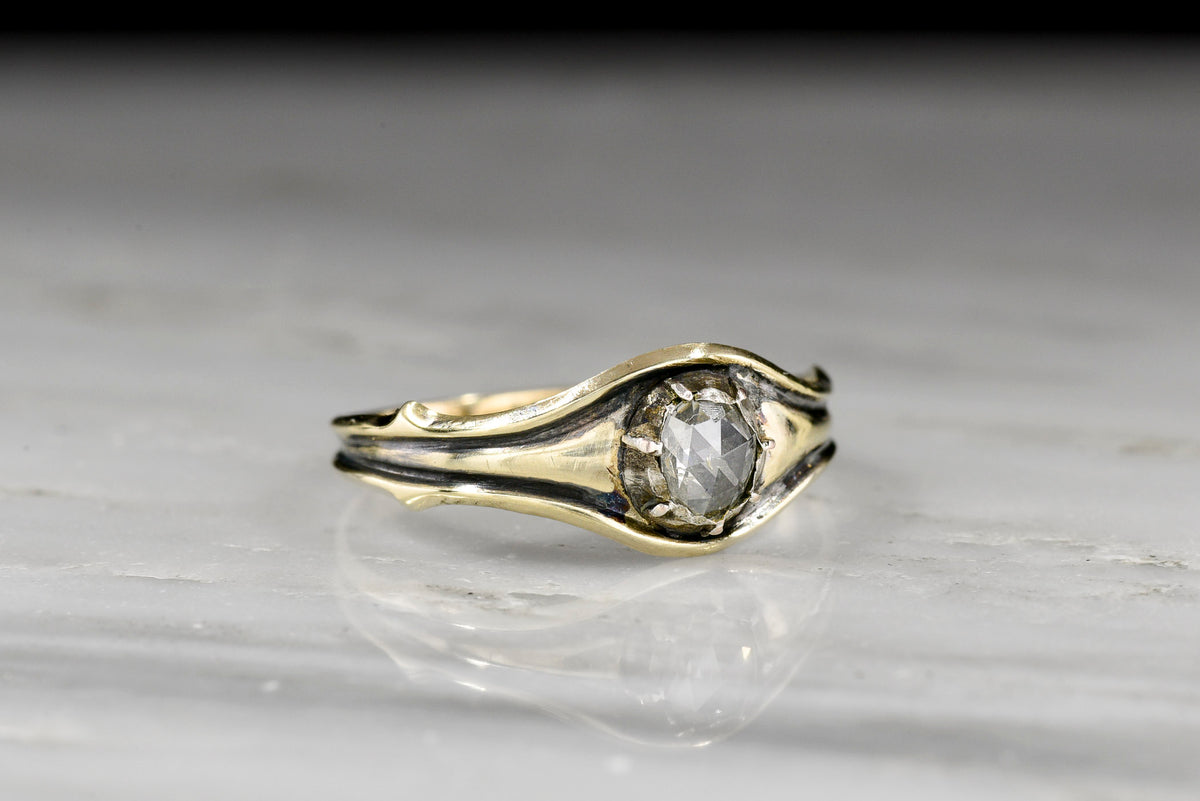 Antique Georgian Gold and Silver Ring with a Collet-Set Antique Rose Cut Diamond