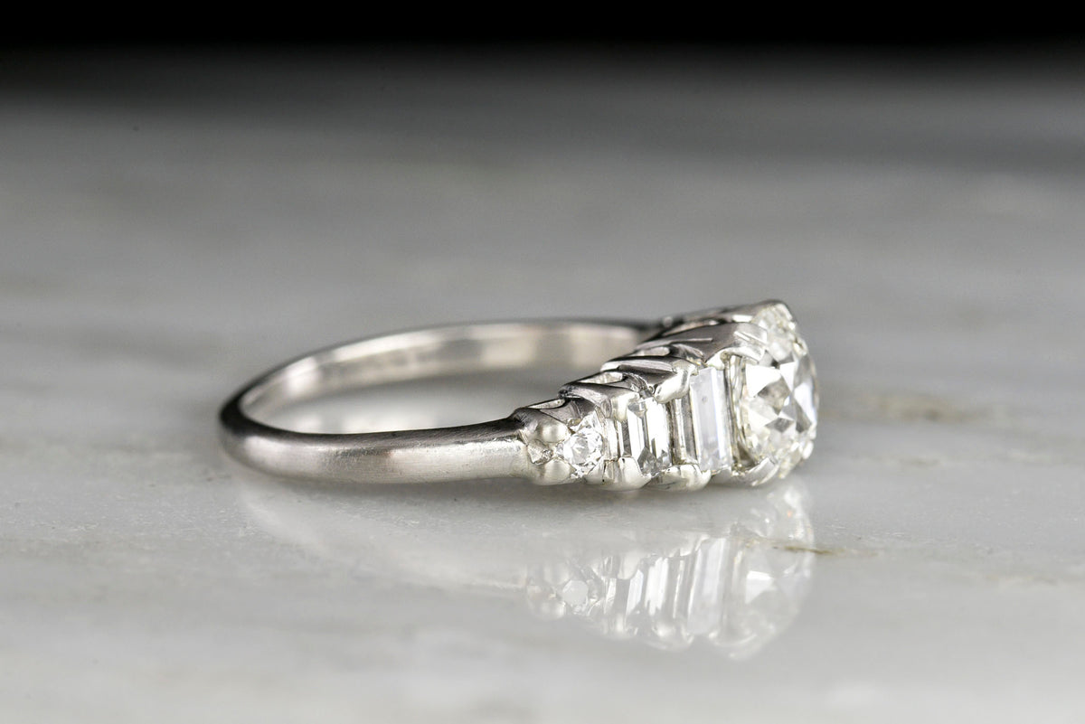 Art Deco Engagement Ring with an Old Mine Cut Diamond Center and Graduated Baguette Cut Sides
