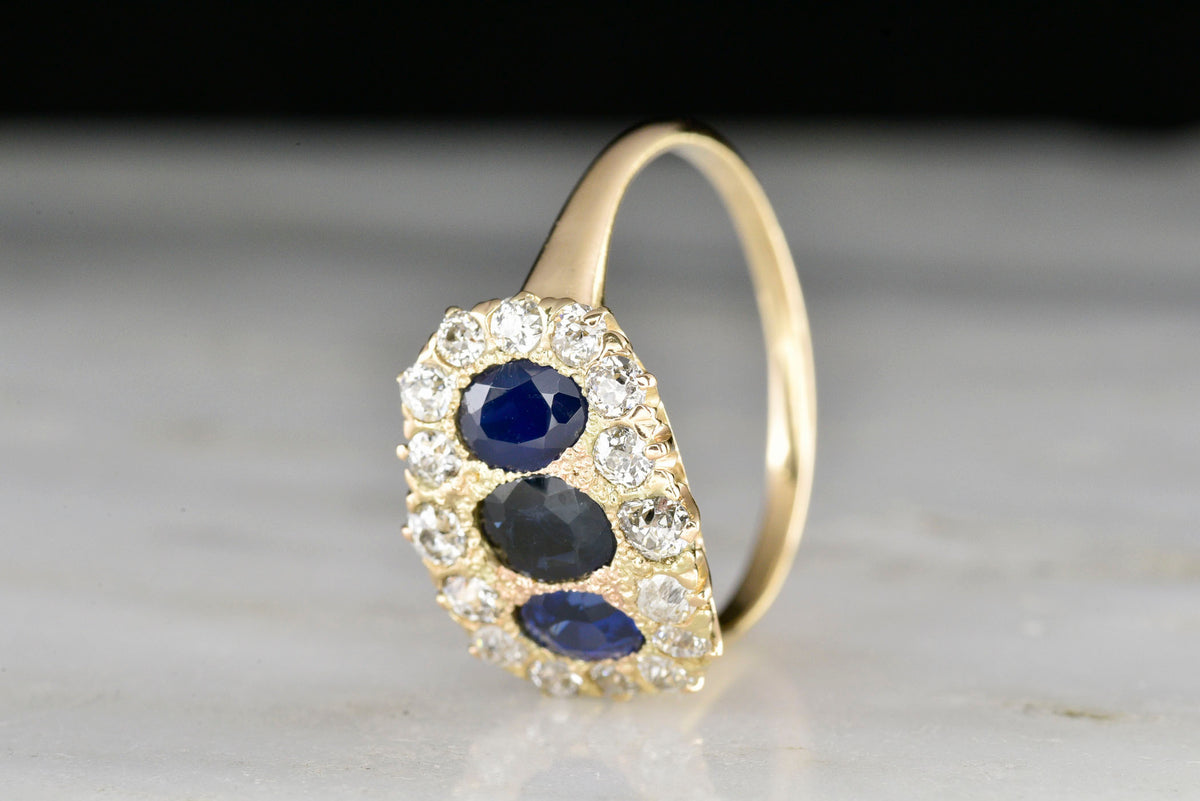 Late Victorian Oval Cut Sapphire and Diamond Ring