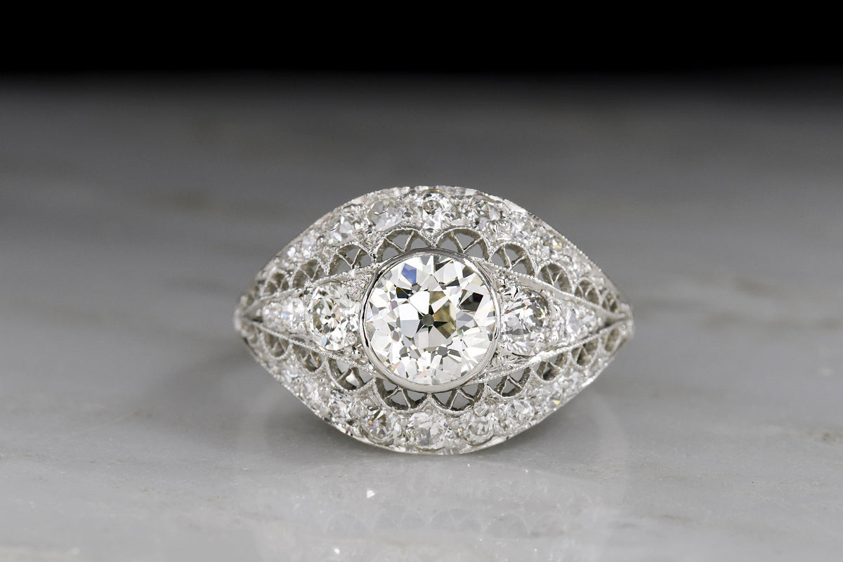 Late Edwardian / Art Deco Platinum and Diamond Dinner Ring; 1.01 Carat Old European Cut Diamond Center