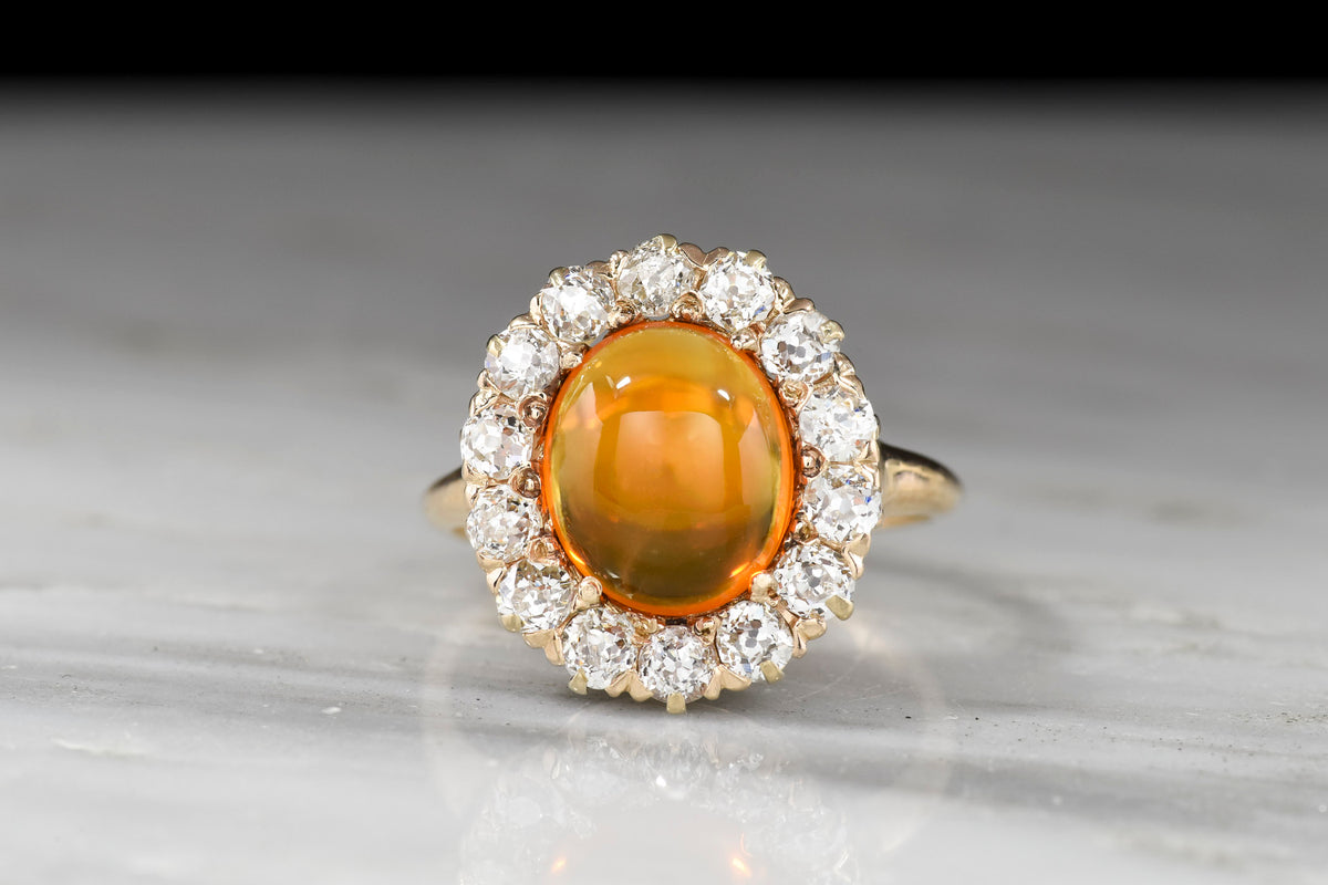 c. 1900 Late Victorian Cabochon Cut Fire Opal and Old Mine Cut Diamond Cluster Ring