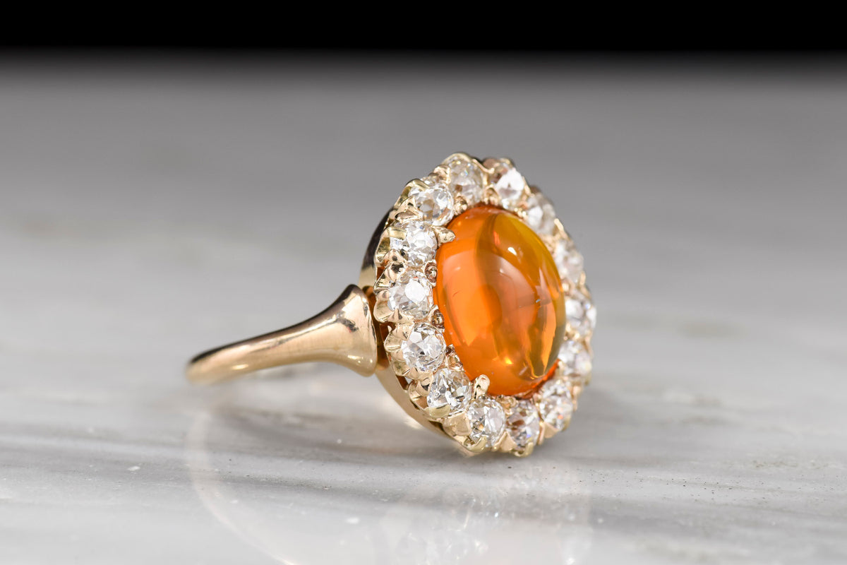 c. 1900 Late Victorian Cabochon Cut Fire Opal and Old Mine Cut Diamond Cluster Ring