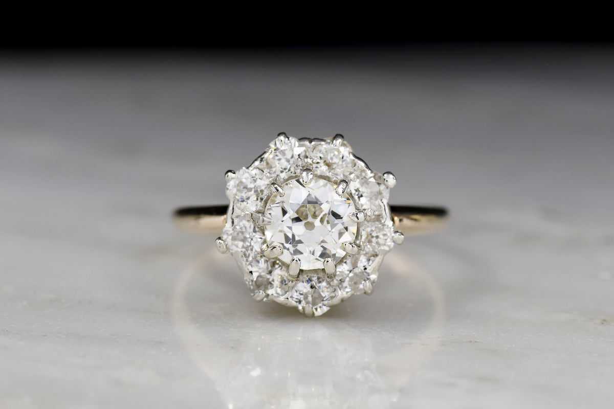 c. 1900 Gold and Platinum Cluster Ring with an Old European Cut Diamond Center