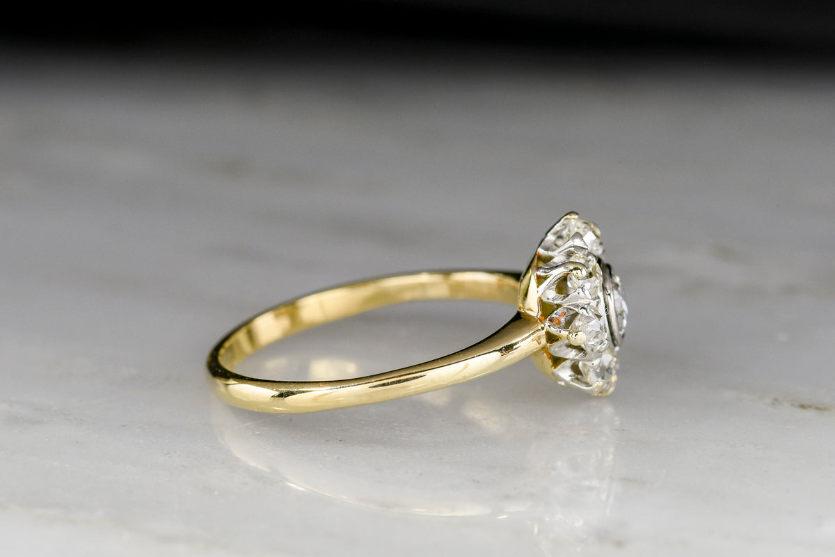 Petite Early 1900s Post-Victorian Gold and Platinum Diamond Cluster Ring