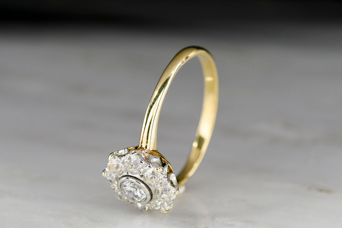 Petite Early 1900s Post-Victorian Gold and Platinum Diamond Cluster Ring
