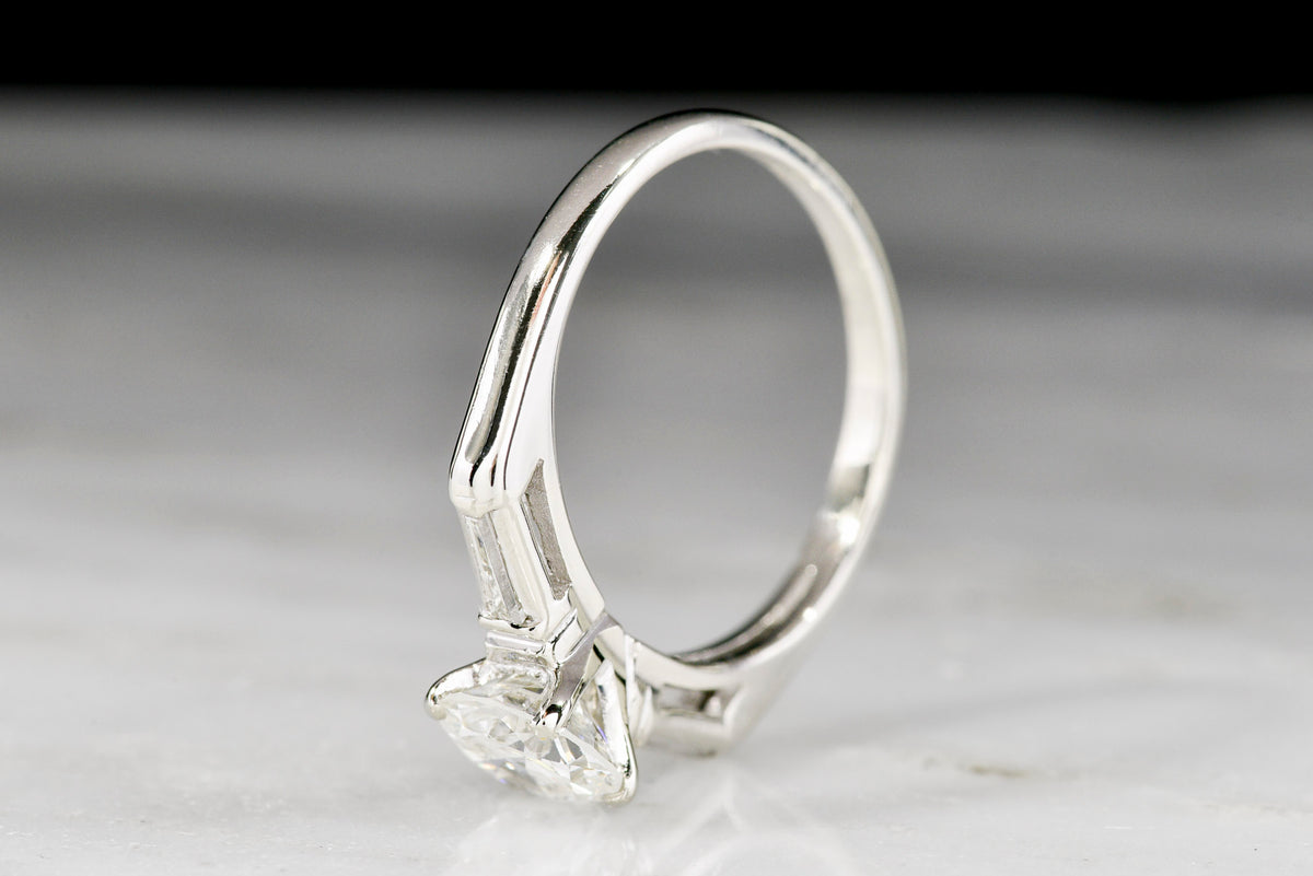 Classic c. 1950s Midcentury Engagement Ring with Graduated Baguette Cut Diamond Shoulders