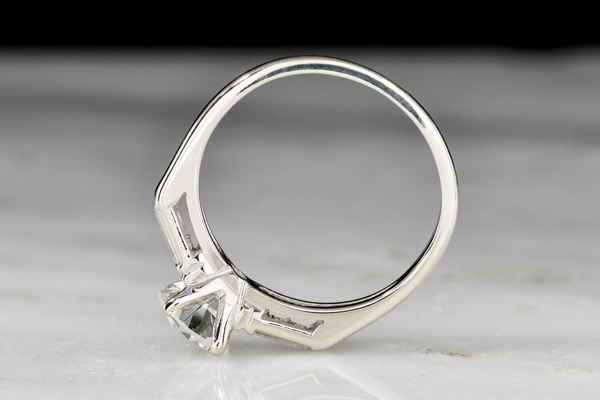 Classic c. 1950s Midcentury Engagement Ring with Graduated Baguette Cut Diamond Shoulders