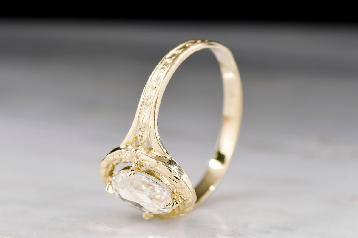 Victorian Revival / Neoclassical Gold Engagement or Right-Hand Ring with an Oval Rose Cut Diamond Center