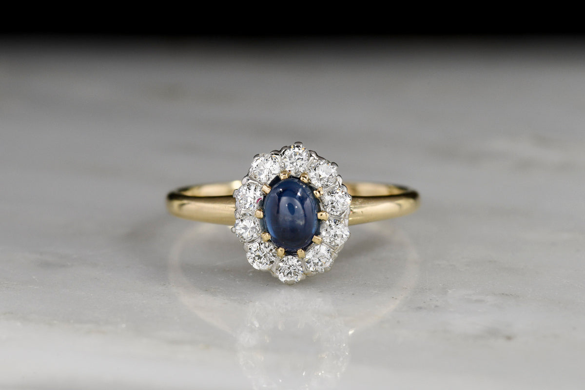 Two-Tone Cluster Ring with a Cabochon Cut Sapphire Center