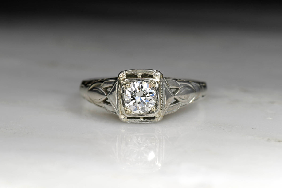 Late Art Deco / Retro Engagement Ring with a Round Brilliant Cut Diamond Center