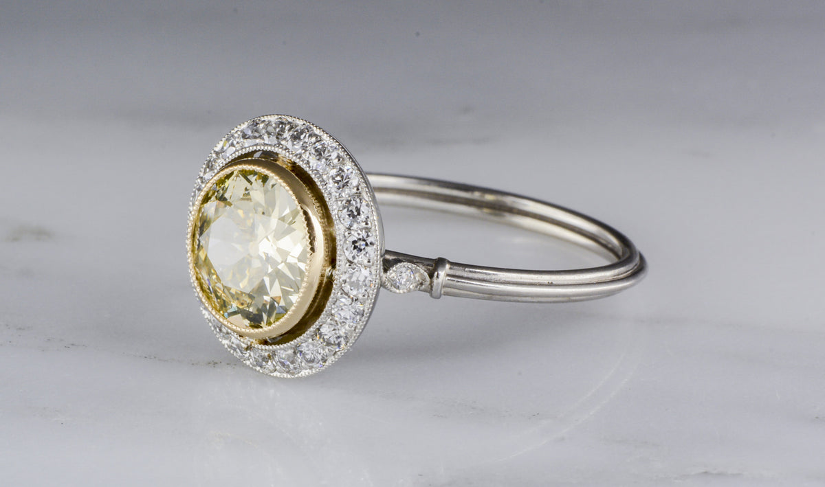 1.36 Carat Fancy Light Yellow Old European Cut Diamond in Art Deco Platinum Engagement Ring with .35 ctw Diamond Accents